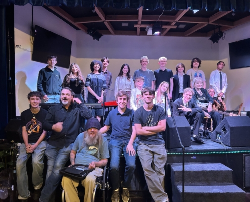 10-12 event photo with all musicians, judges & advisors. 